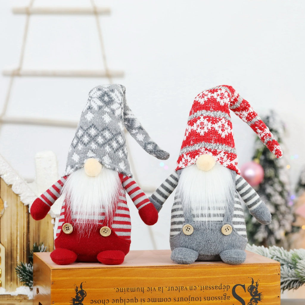 Christmas elf figure with knitted hat, sitting