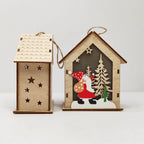 Illuminated wooden Christmas house as tree ornament