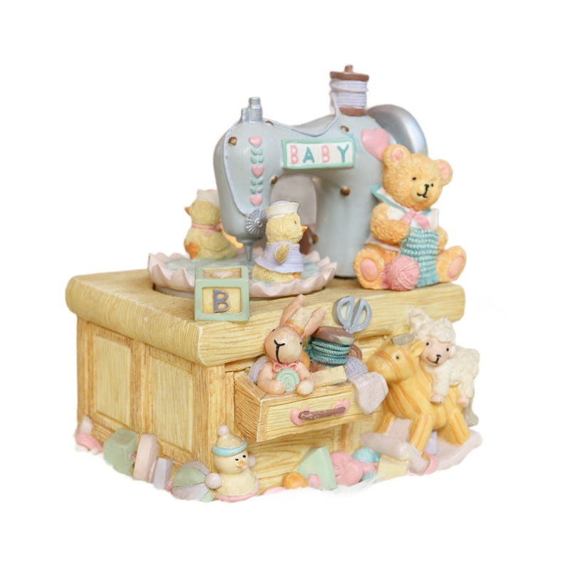 Music box in sewing machine design with bear motif