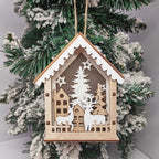 Illuminated wooden Christmas house as tree ornament
