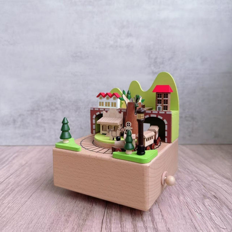 Manual music box made of beech wood with forest train motif
