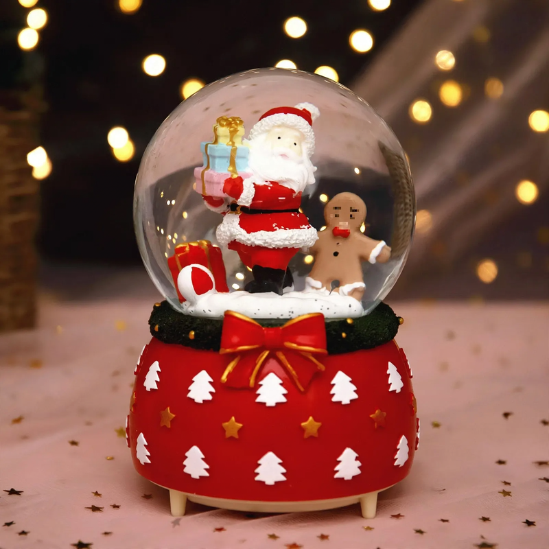 Illuminated snow globe music box, resin
