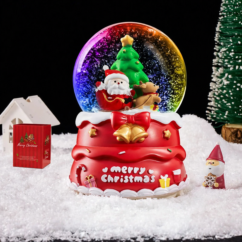Christmas snow globe with music box and carriage design