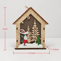 Illuminated wooden Christmas house as tree ornament