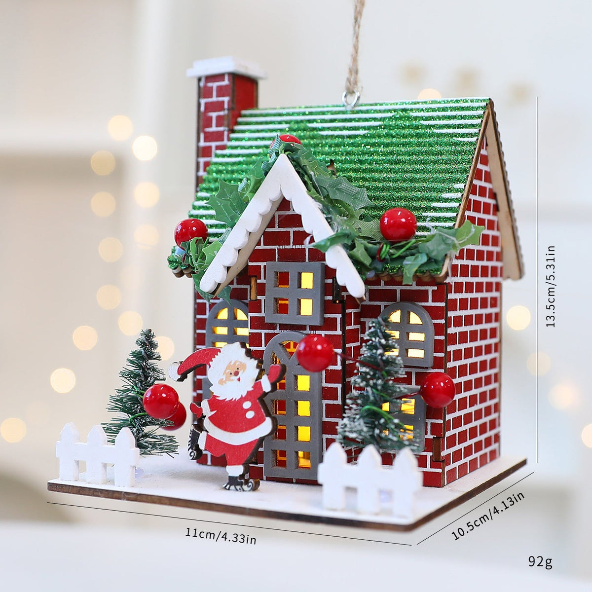 Decorative wooden Christmas house as hanging decoration or display piece