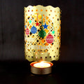 Rotating tealight holder made of brass, classic design