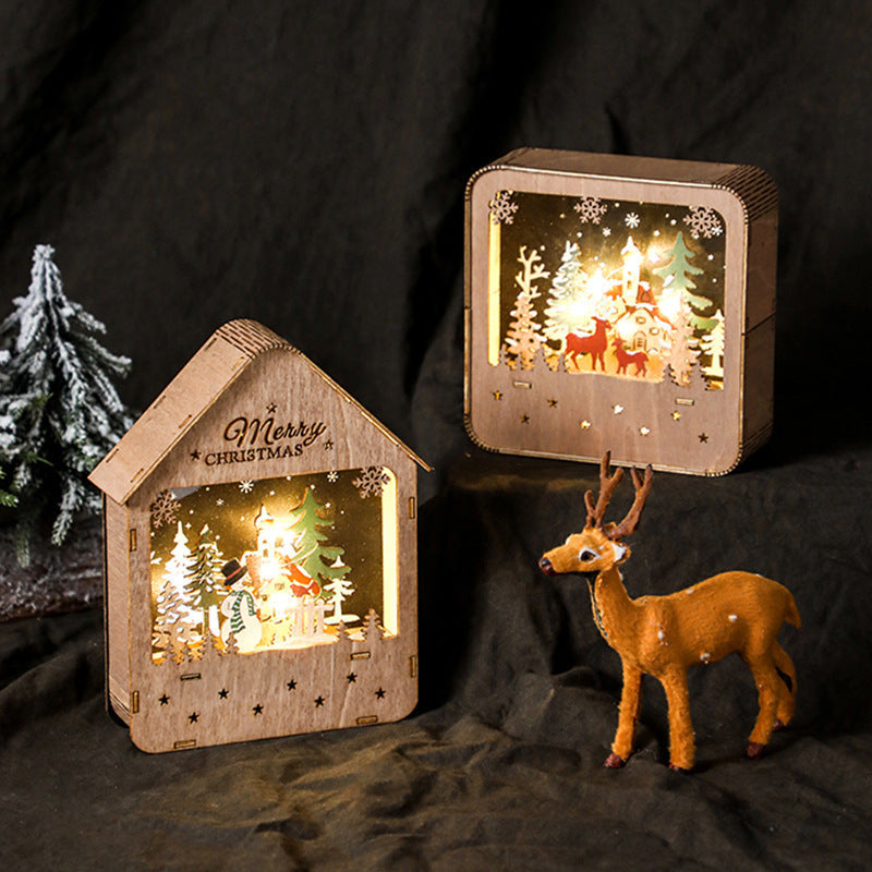 Illuminated wooden house with Christmas motif