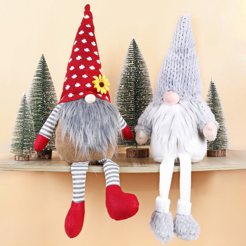 Christmas elf figure with long legs, sitting