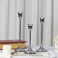 Decorative metal candle holder in bell design