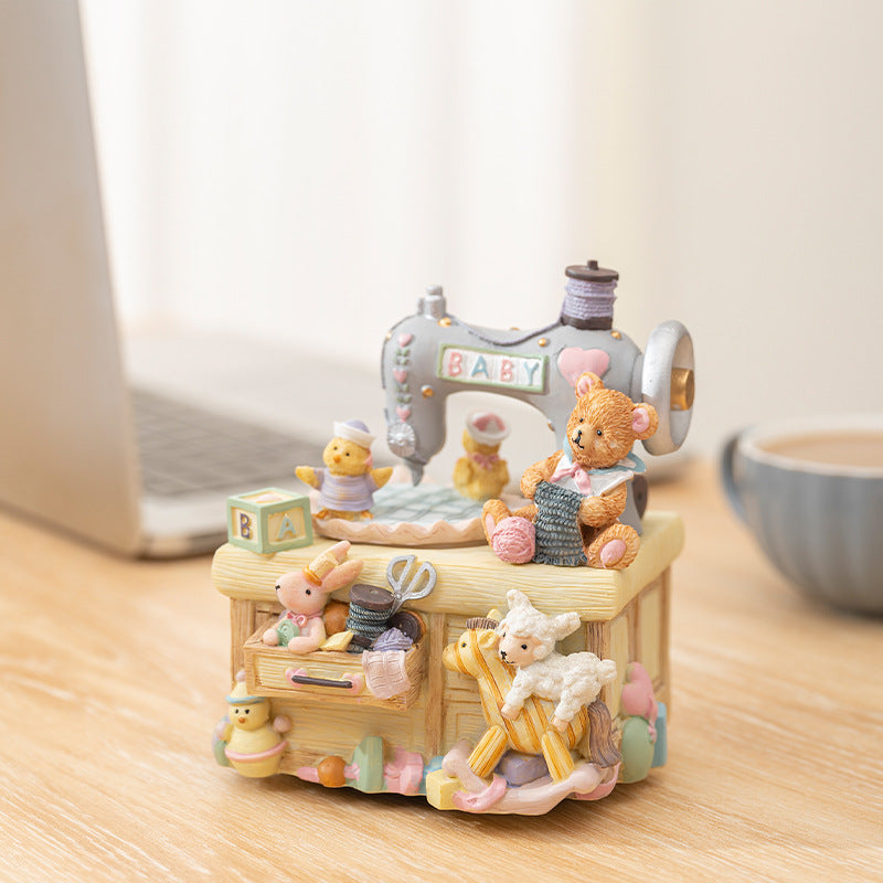 Music box in sewing machine design with bear motif