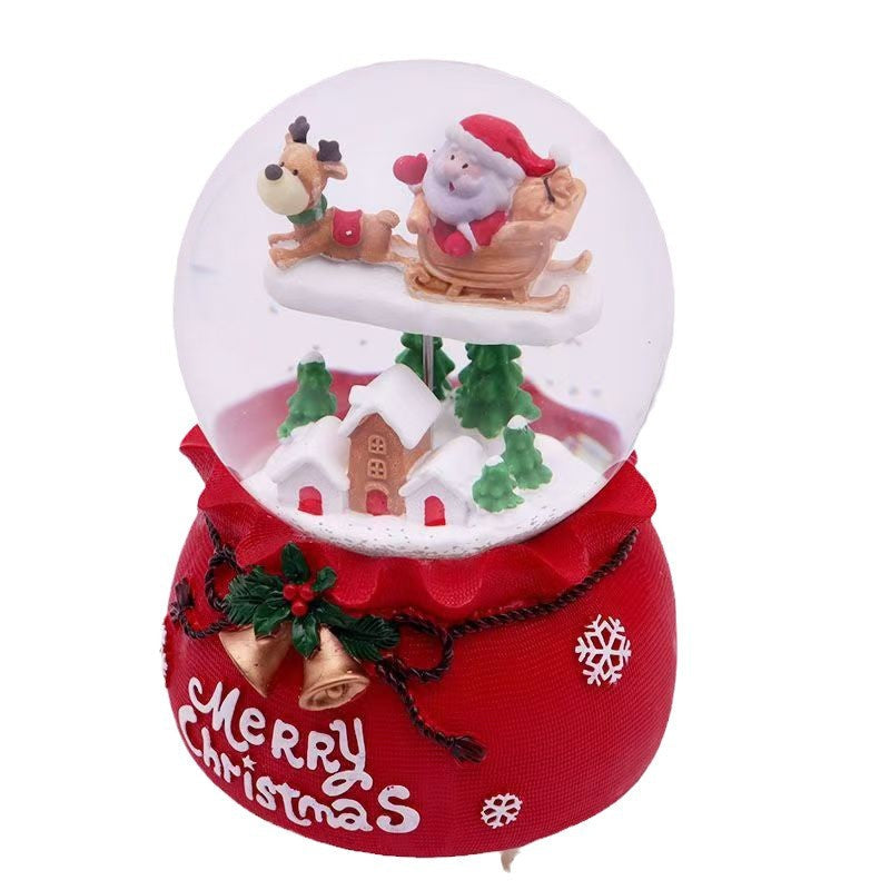 Illuminated snow globe music box with music