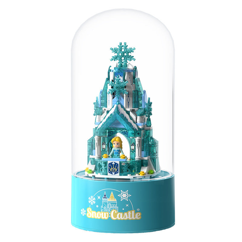 Rotating music box with light and snowfall