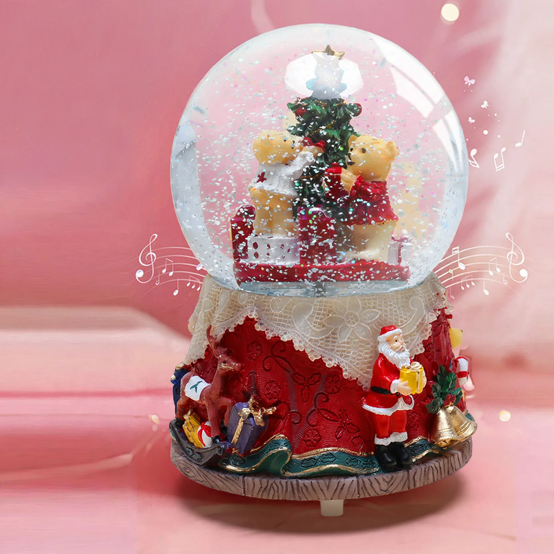 Decorative music box with snow globe motif