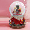 Decorative music box with snow globe motif