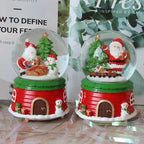 Illuminated snow globe music box, resin