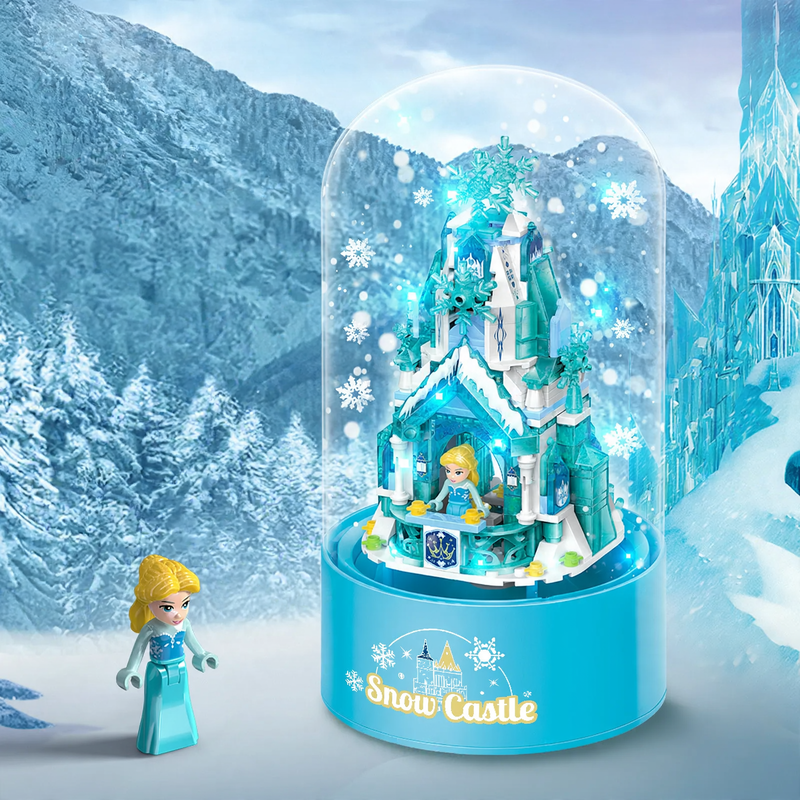 Rotating music box with light and snowfall