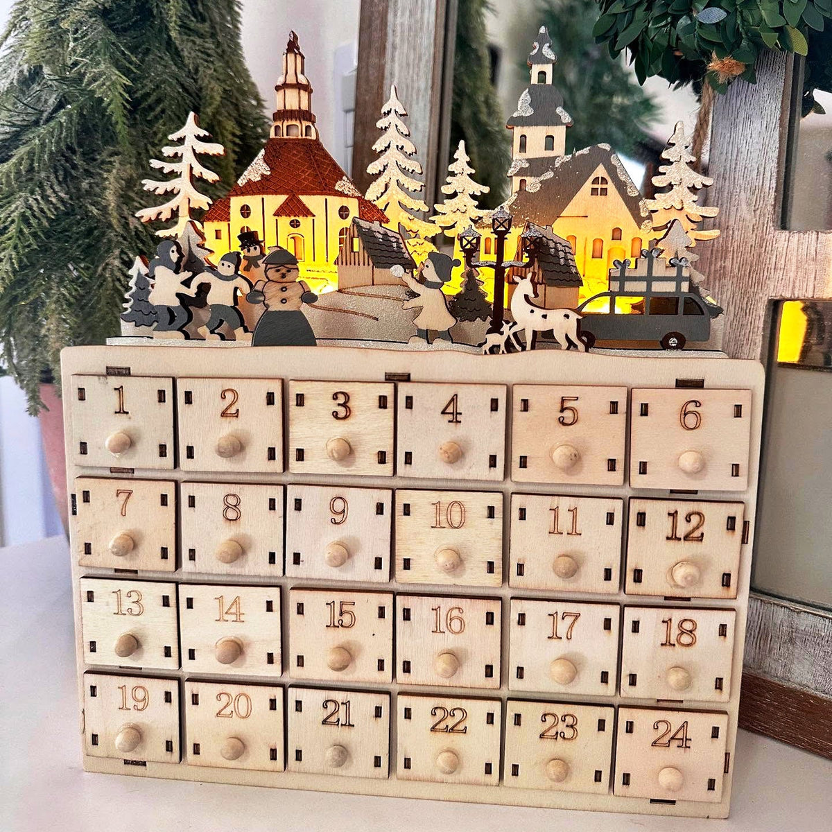 Christmas Advent calendar made of wood with 24 drawers