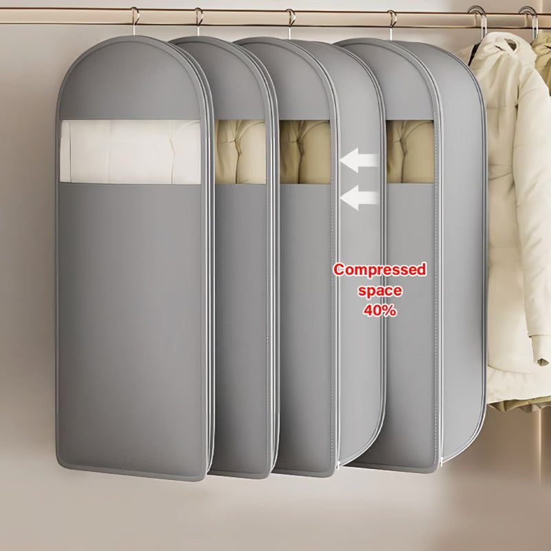 Space saving hanging garment bag with self-compressing zipper