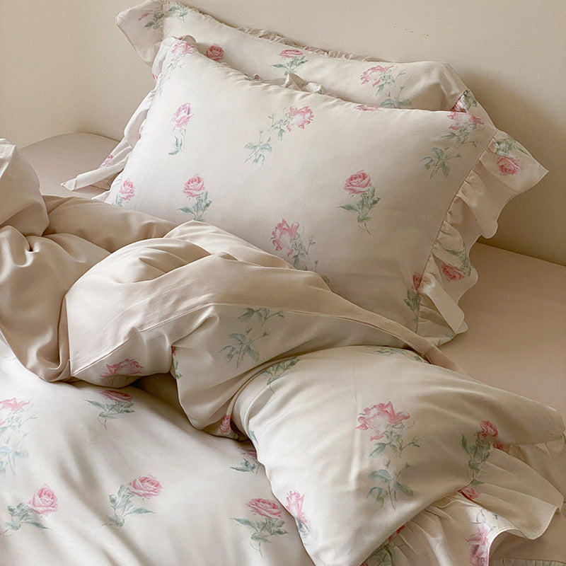 Luxurious satin bedding set with delicate rose pattern and ruffled hem