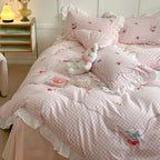 Playful cotton bedding set with ruffles and appliqués