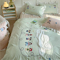 Playful cotton bedding set with ruffles and appliqués
