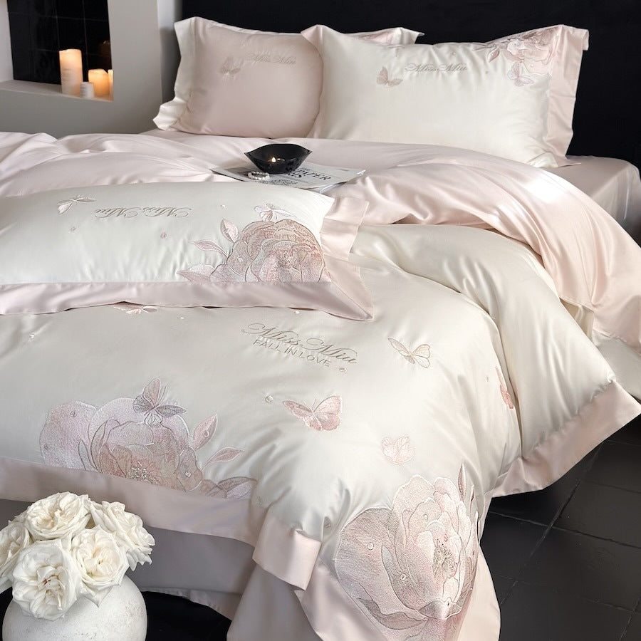 Luxurious satin bedding set with delicate rose and butterfly embroideries