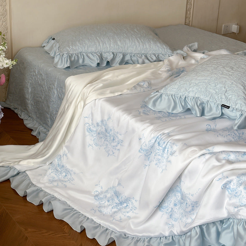 Quilted bedspread with ruffle and reversible satin bedding set