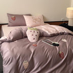 Luxurious cotton satin bedding set with embroidered strawberry appliqués