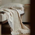 Quilted bedspread and pillowcase in a washed linen look with a crochet trim
