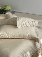 Bedding set made of cotton satin with ruffle, subtle jacquard floral relief and silky-matt finish