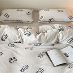 Cozy microfleece bedding set with cute dog motifs and piped edges