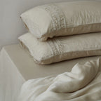 Linen bedding set with stonewash finish and delicate ruffle inserts