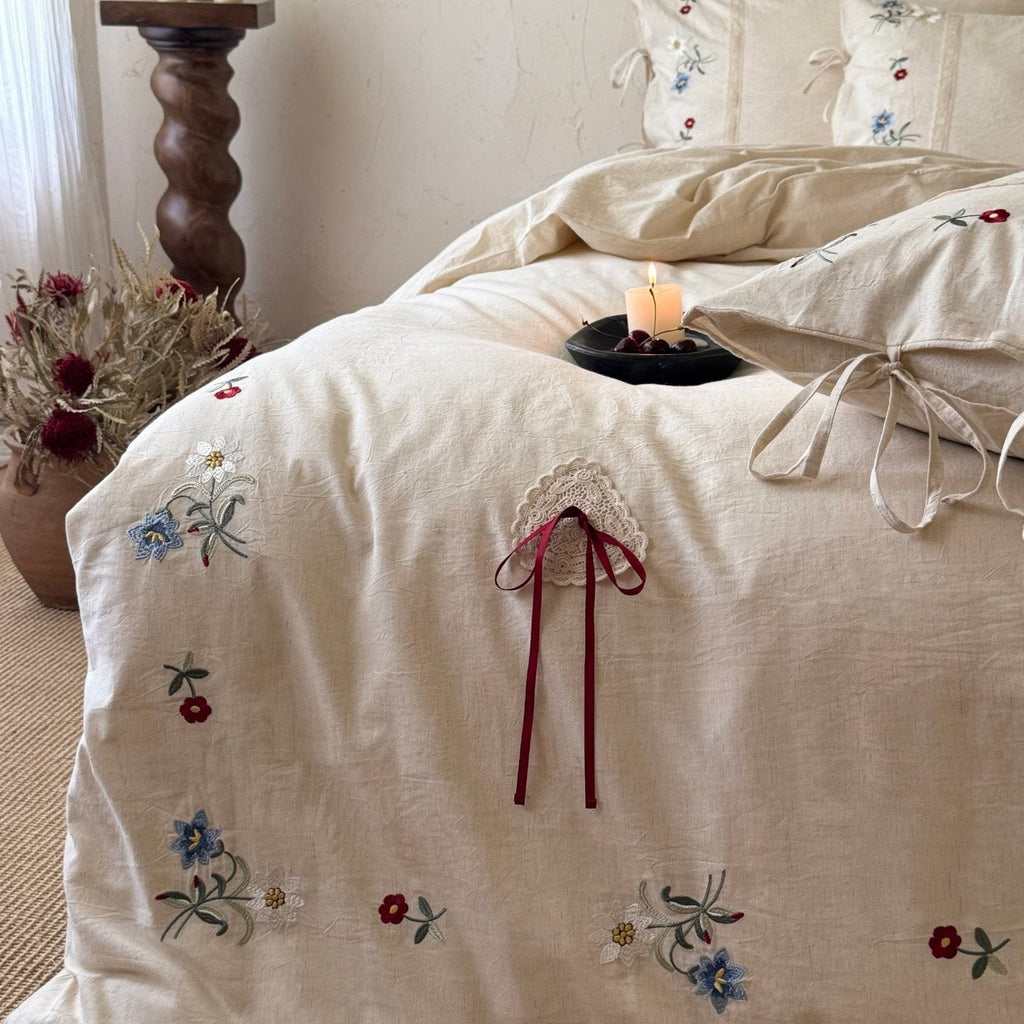 Bedding set made of linen look with floral embroidery and bow closure