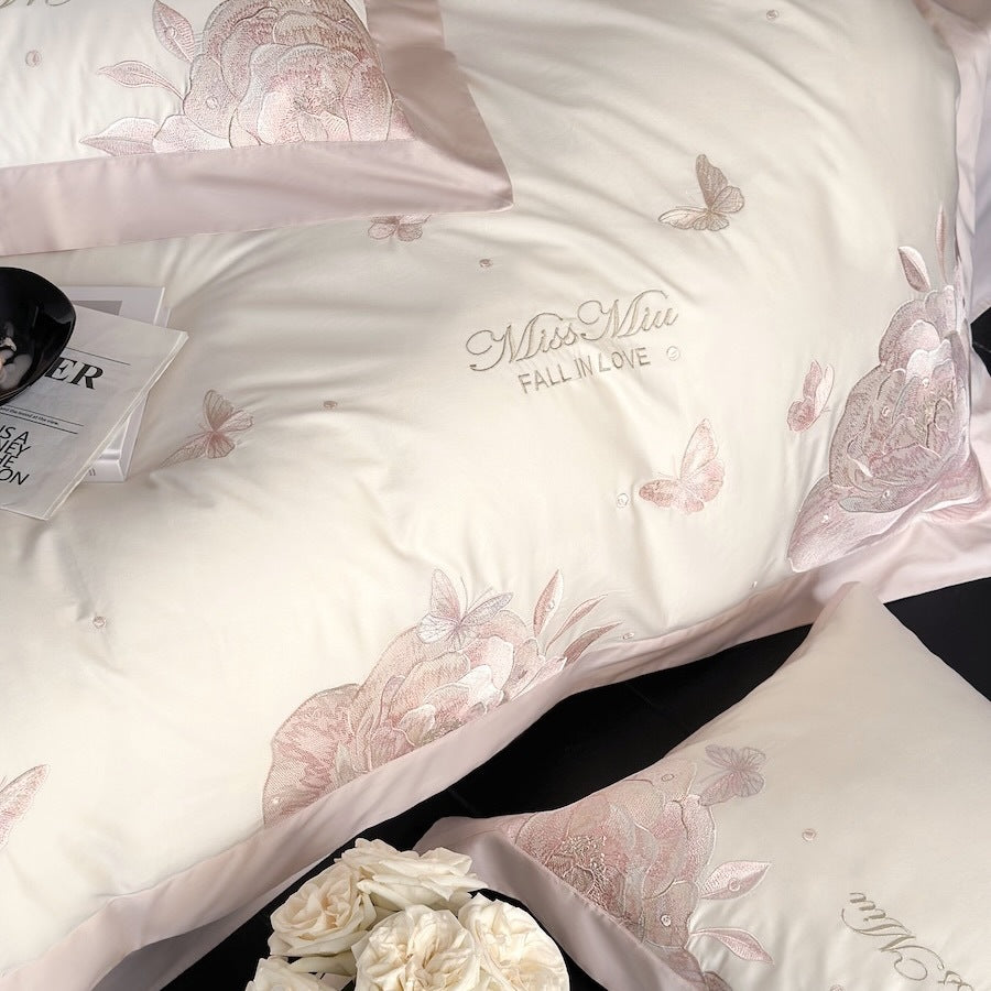 Luxurious satin bedding set with delicate rose and butterfly embroideries
