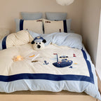 Children's bedding set with quilted blanket, waffle texture and embroidered sea motif