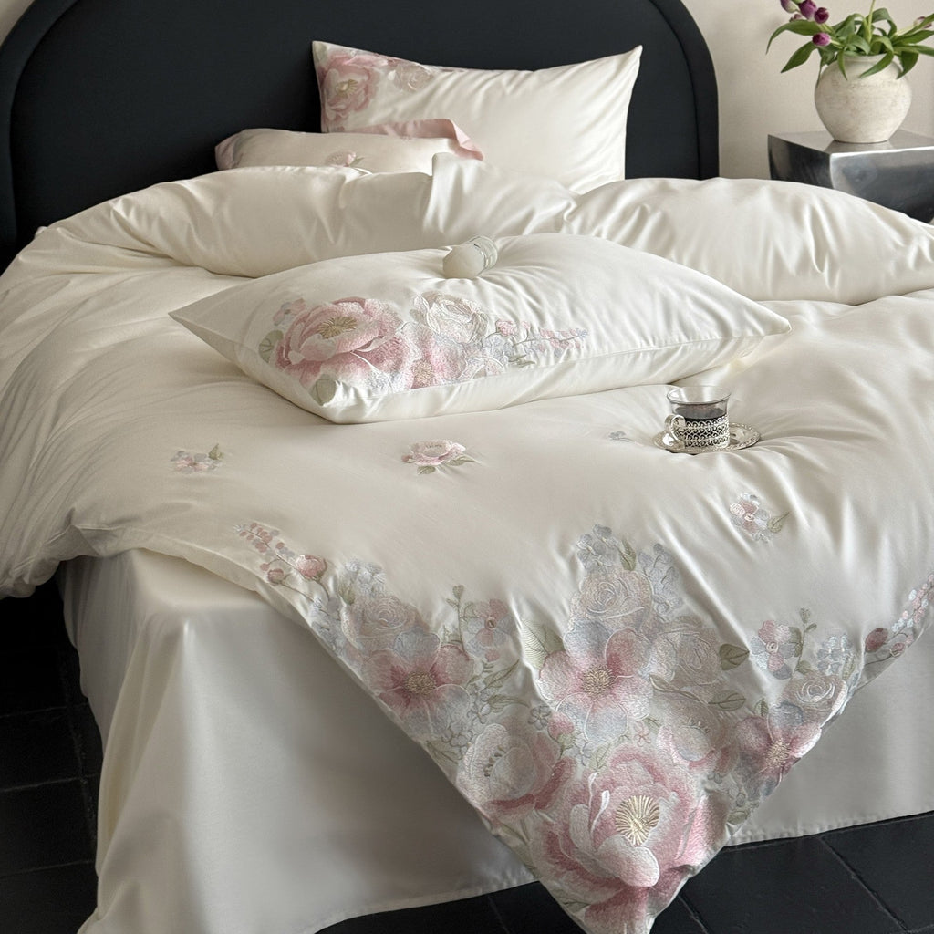 Embroidered satin bedding set with floral relief embroidery and silky finish