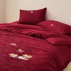 Premium bedding set made of Mako cotton satin with floral jacquard structure and embroidered applications Bowlift