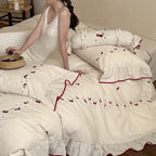 Bedding set with delicate cherry embroidery, ruffle and linen look
