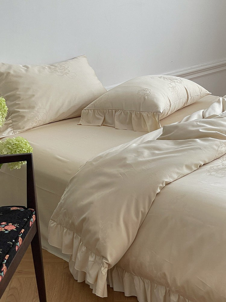 Bedding set made of cotton satin with ruffle, subtle jacquard floral relief and silky-matt finish