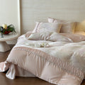 Extra soft satin duvet cover set with voluminous ruffle, subtle watercolor leaf print and concealed closure