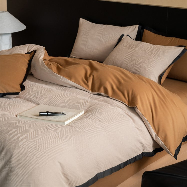 Reversible bedding set with jacquard structure and contrast piping Bowlift