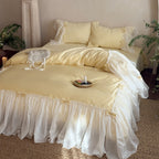 Bedding set with ruffled bed skirt, ruffle cushion and bow application