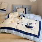 Children's bedding set with quilted blanket, waffle texture and embroidered sea motif