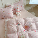 Playful cotton bedding set with ruffles and appliqués
