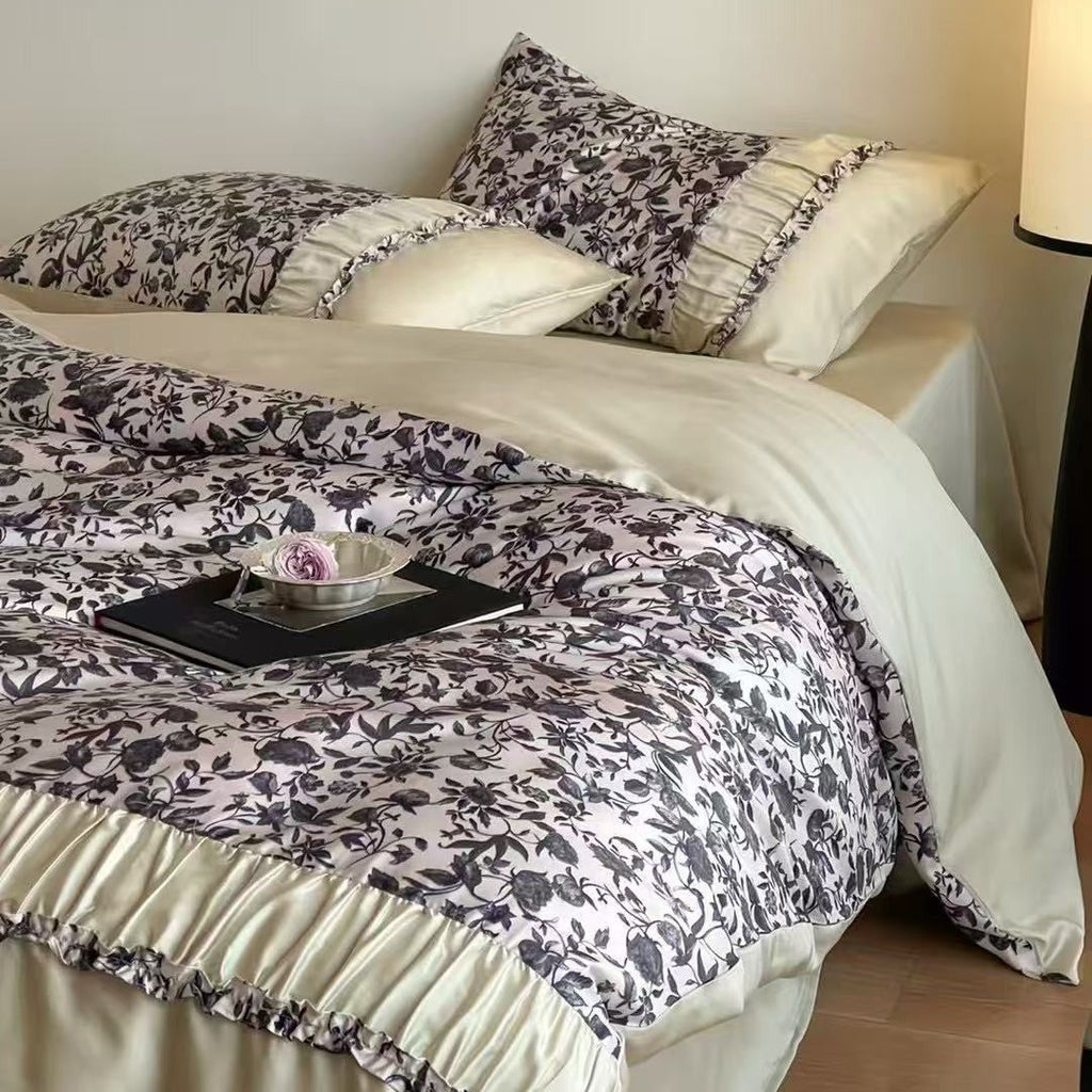 Extra soft satin duvet cover set with voluminous ruffle, subtle watercolor leaf print and concealed closure
