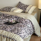 Extra soft satin duvet cover set with voluminous ruffle, subtle watercolor leaf print and concealed closure