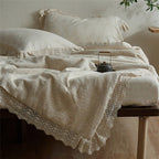 Quilted bedspread and pillowcase in a washed linen look with a crochet trim