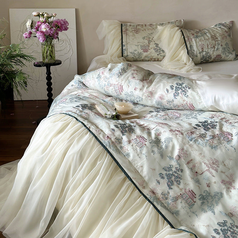 Satin bedding set with ruffled bed skirt and vintage toile print