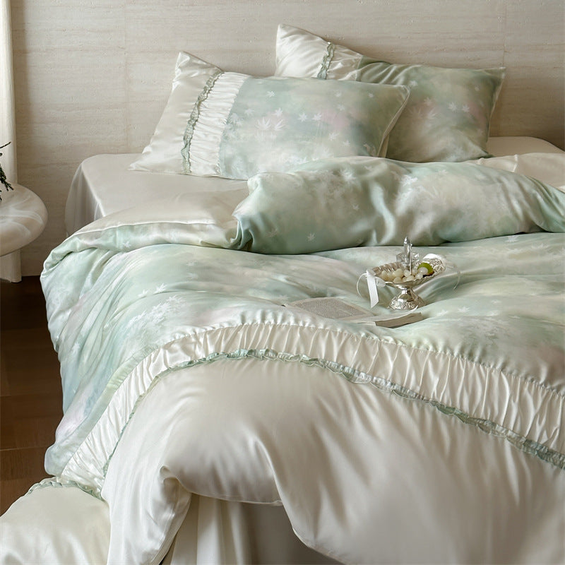 Extra soft satin duvet cover set with voluminous ruffle, subtle watercolor leaf print and concealed closure