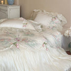 Romantic bedding set with ruffled frill, embroidered decorative pillows, and flowing pleated bedspread Bowlift